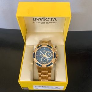Mens Gold Invicta watch. Never been worn. Still has wrapping on band.